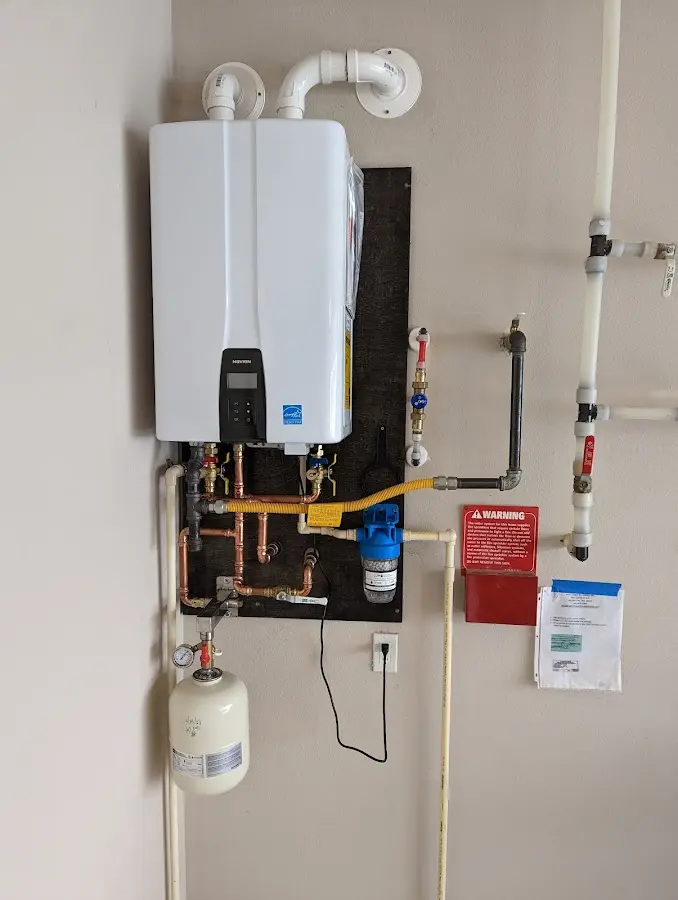 Professional plumber installing copper piping in a Hagerstown home